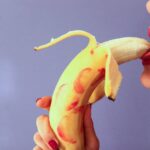 woman with banana thinking about sex